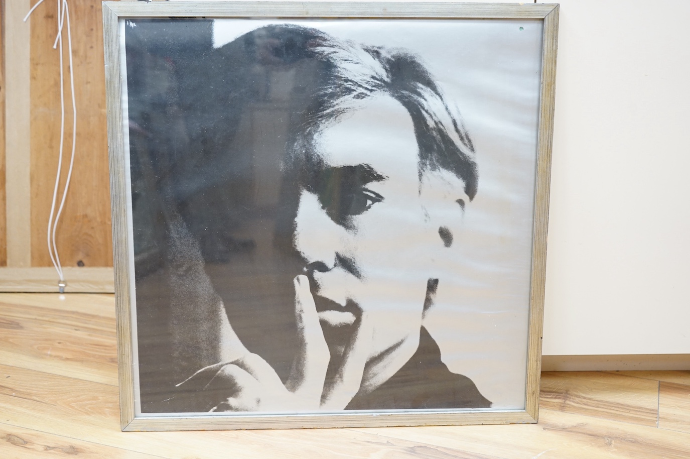 Andy Warhol - a signed print on silver paper, from a silkscreen, ‘Self Portrait’, 1966, signature reading; Andy Warhol 66 93/300, 56x56cm square. Condition - poor to fair, some creasing and slight possible water damage t